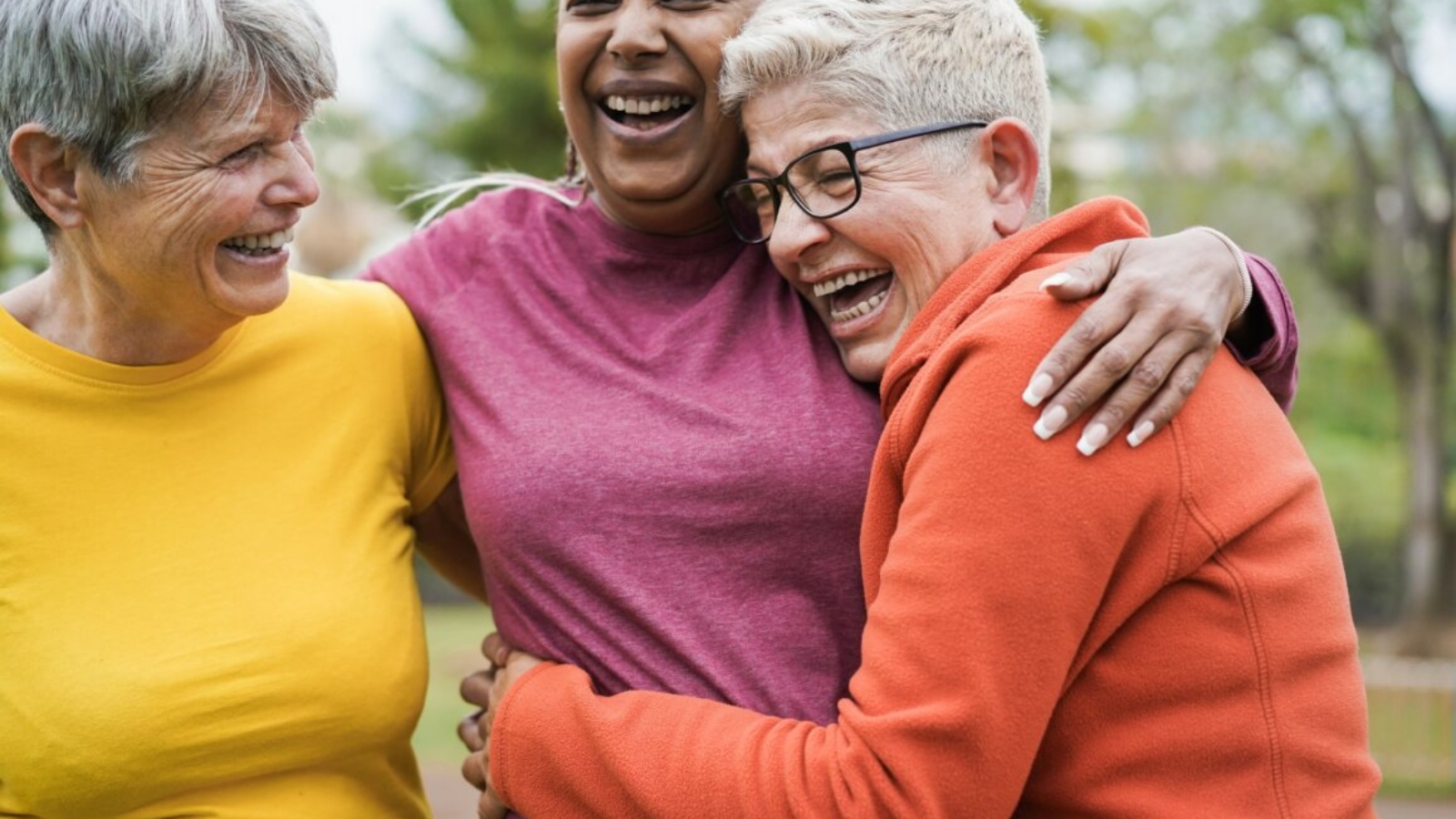 Multiracial senior women having fun together after sport workout outdoor - Main focus on right female face